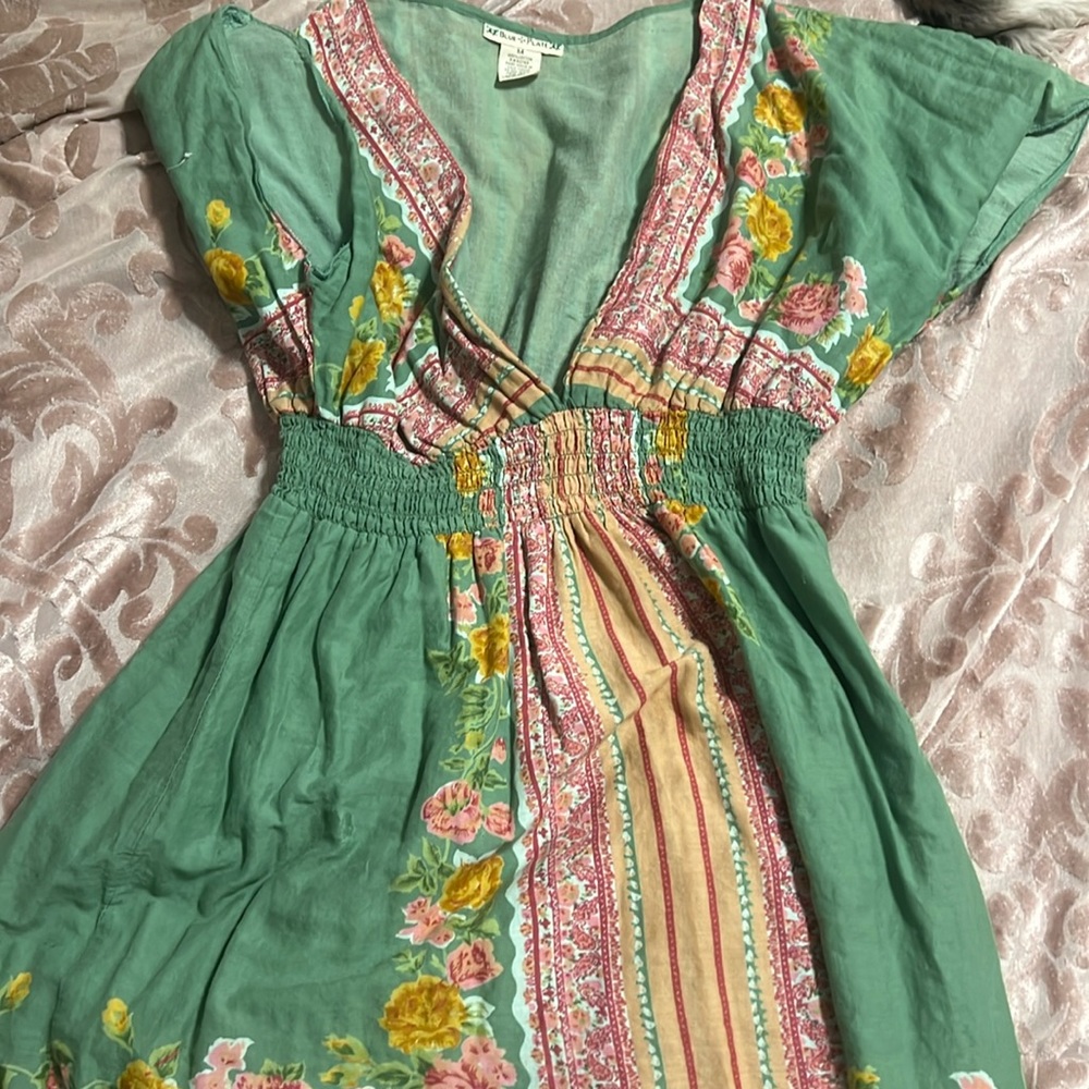 Blue Plate size medium peasant Blouse with a high rouched waist and flare .